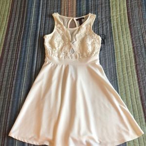 For sale women’s dress in cream small mini